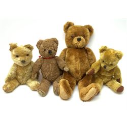 Four 1950s English teddy bears including a Chad Valley brown alpaca wool bear with swivel jointed head, glass type eyes, vertically stitched nose and mouth and jointed limbs H15