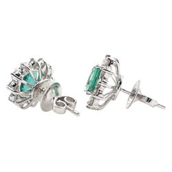Pair of 18ct white gold, cushion cut emerald and round brilliant cut diamond cluster stud earrings, stamped 18K, total emerald weight approx 2.70 carat, total diamond weight approx 1.10 carat