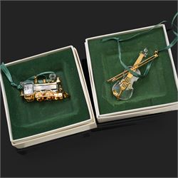 Twelve Swarovski crystal 'Christmas' and 'Crystal' Memories ornaments, comprising Moon, Sun, Boot, Candy Cane, Christmas Wreath, Pinecone and Holly etc, boxed and with sleeves (12)