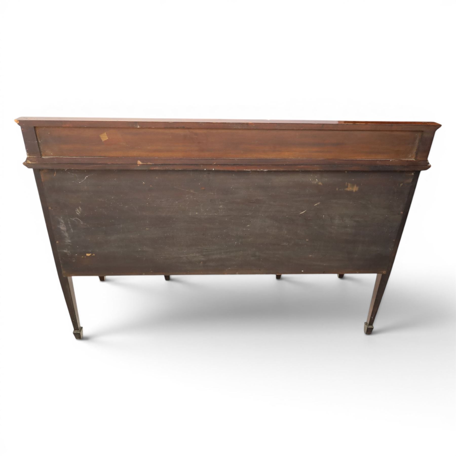 Edwardian mahogany and satinwood sideboard, shaped top with galleried back, with freize drawer flanked by two cabinets, united by undertier, raised on square tapering supports terminating in spade feet