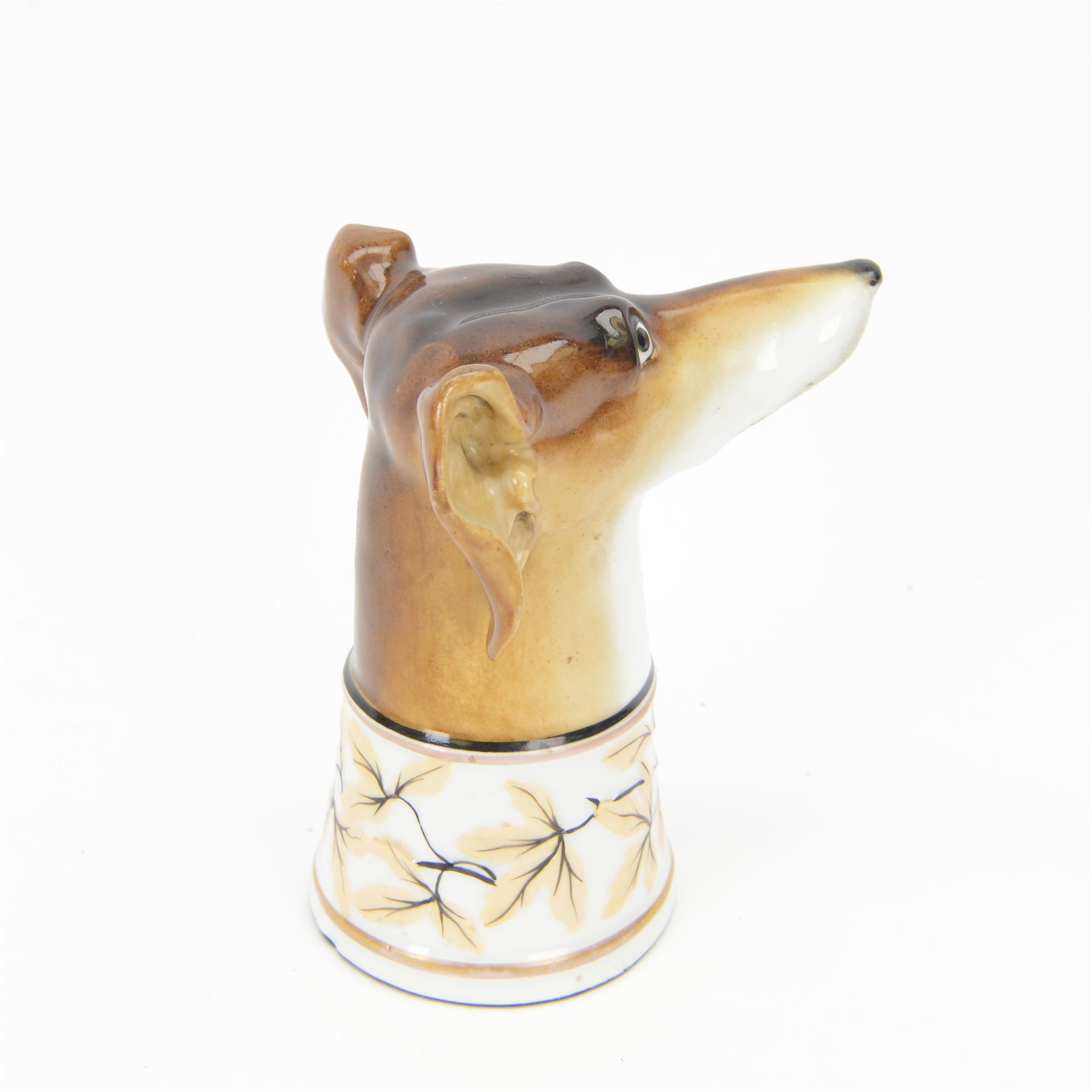 Late 19th century Continental porcelain stirrup cup, modelled as a hounds head, with wide collar detailed with lustre vines, H14.5cm
