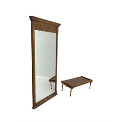 Oak framed mirror with floral carved lower frieze (130cm x 57cm); and a small oak breakfast in bed table 