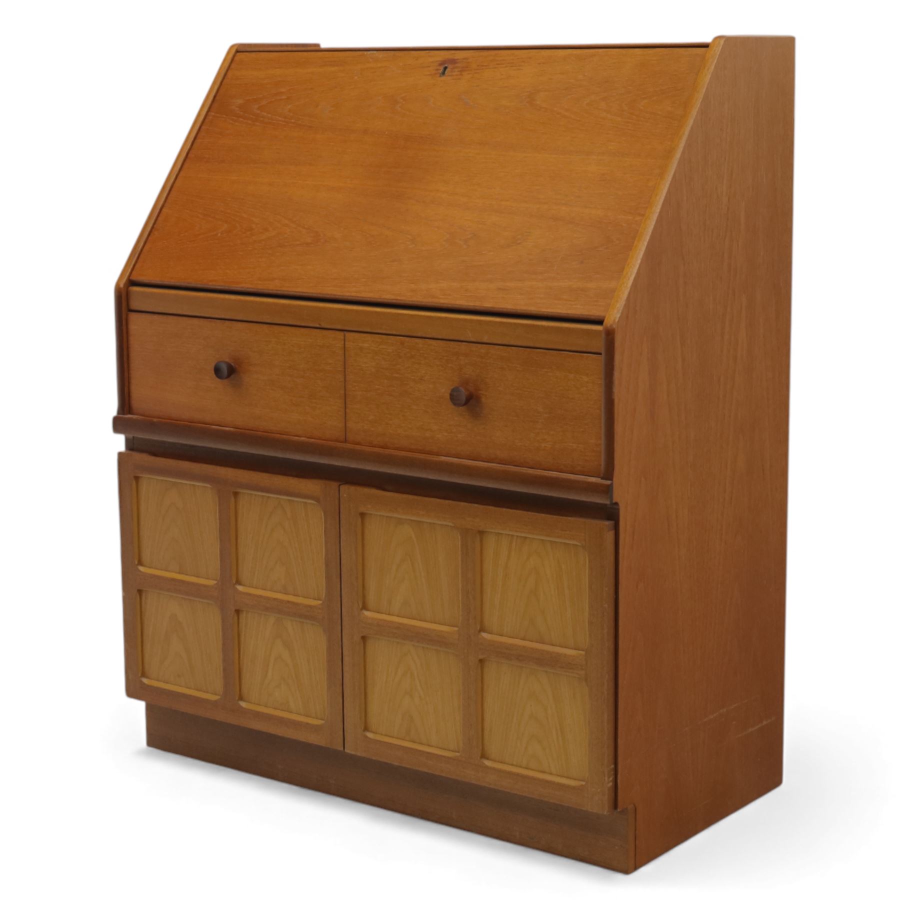 Parker Knoll - teak bureau, sloped fall front enclosing fitted interior, over two short drawers and two panelled cupboard doors