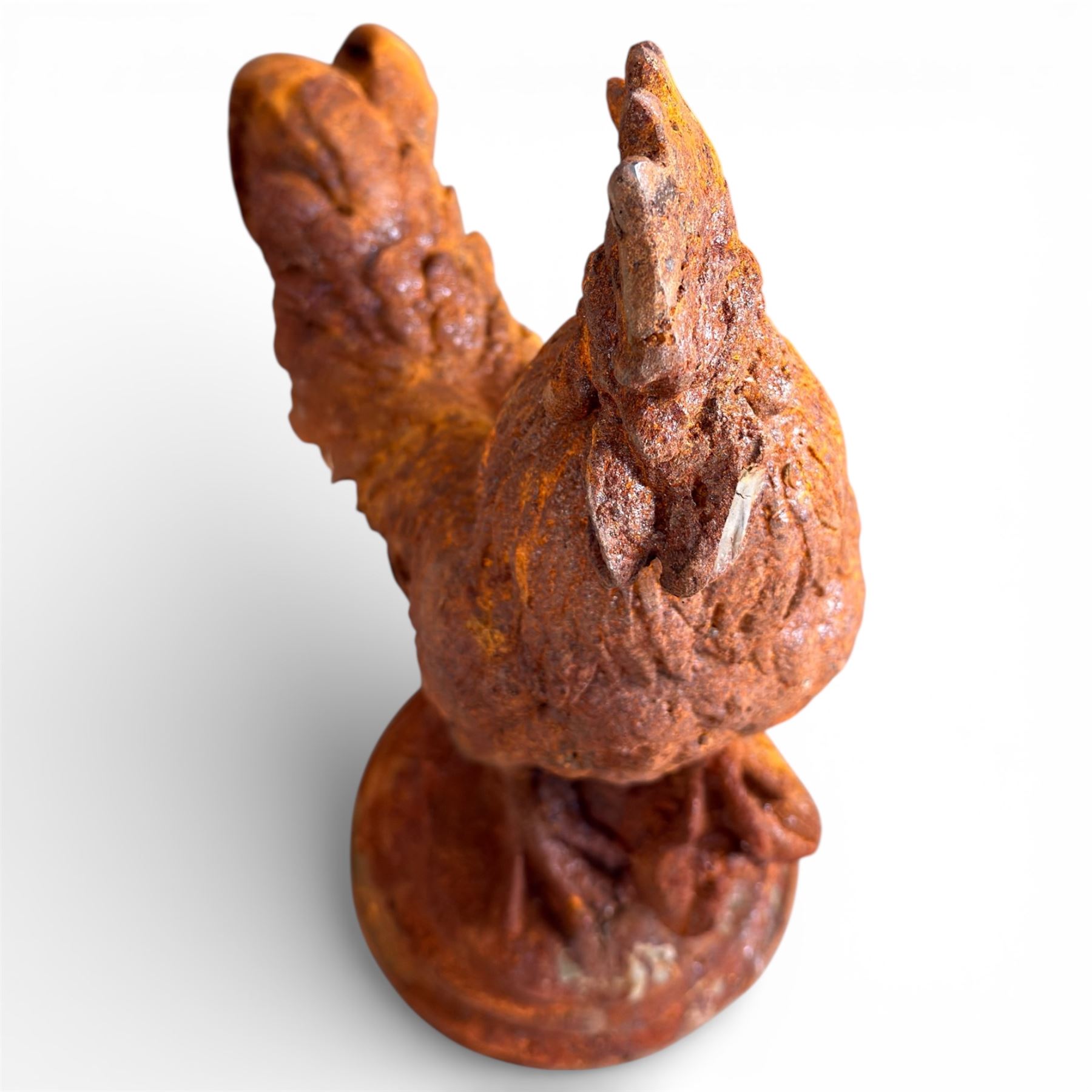 Small cast iron cockerell, on circular base