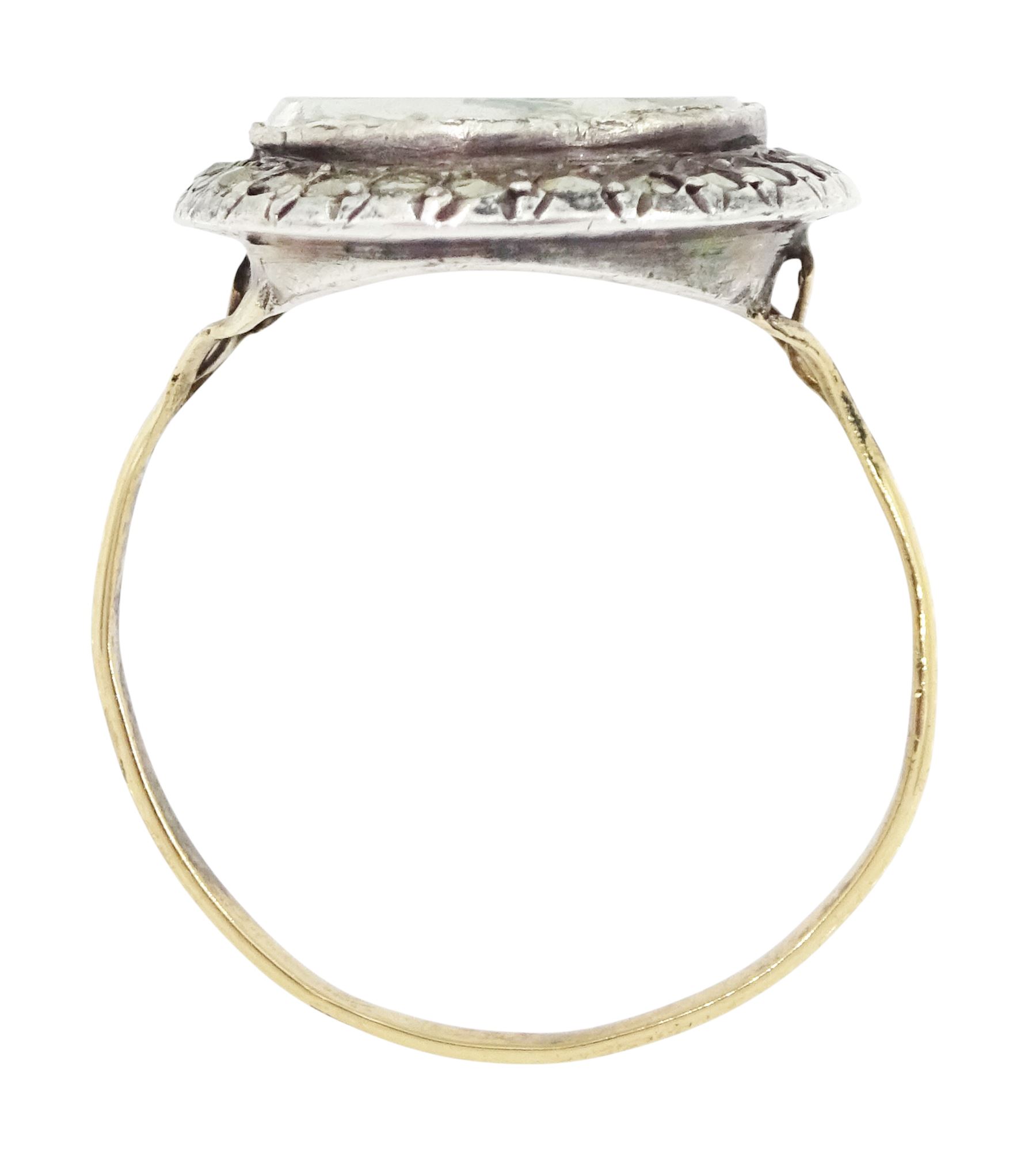 19th century French 18ct gold and silver marcasite portrait ring, set with an oval miniature of a woman on ivory, under glazed panel, with marcasite surround and trifurcated shoulders, hallmarked. This lot has been registered for sale under Section 10 of the APHA Ivory Act