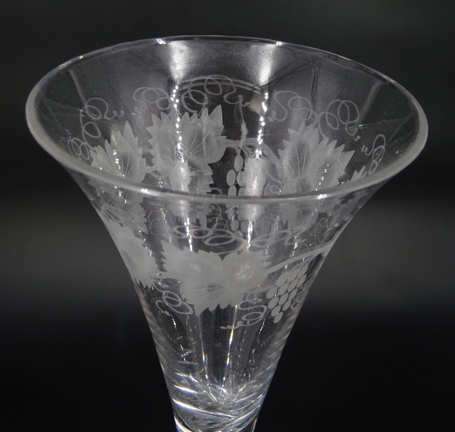Large 19th century wine glass, the drawn trumpet bowl engraved with fruiting vine, upon single series mercury twist stem and conical foot, H25cm 