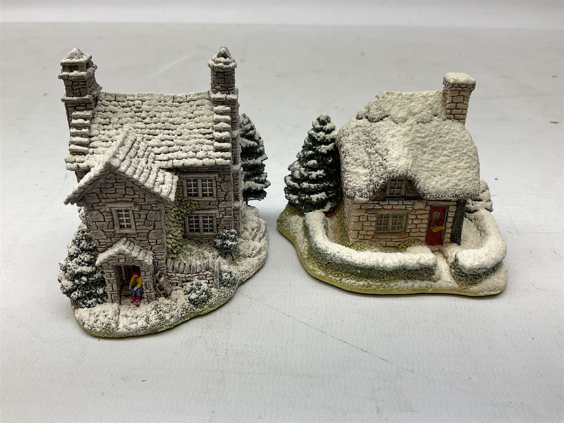 Sixteen Lilliput Lane models from Christmas collections, thirteen boxed and two loose, with various deeds, to include Snowdon Lodge, The Vicarage, Eamont Lodge etc