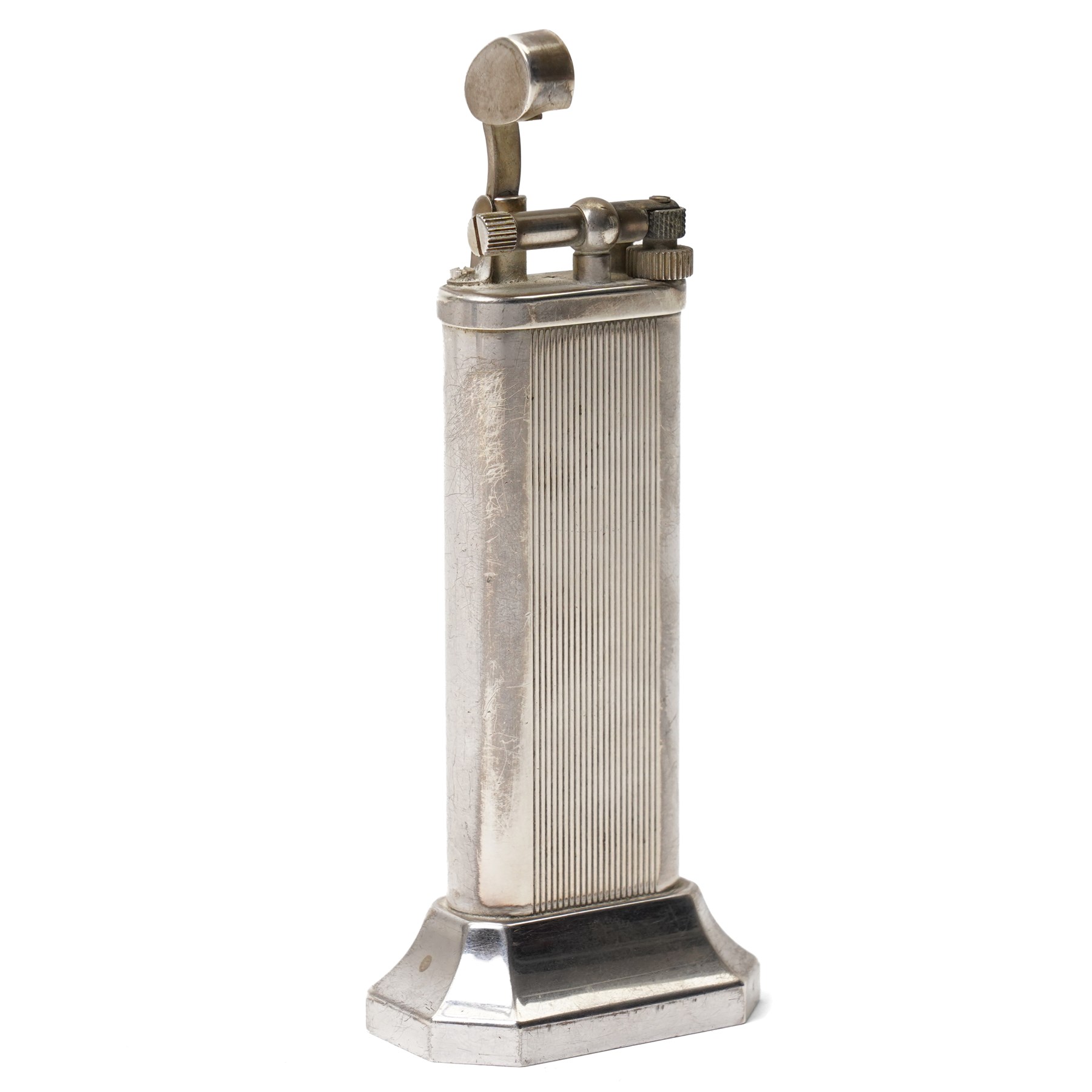 Dunhill - tallboy table lighter, silver-plate with reeded decoration and engine-turned body, on octagonal stepped base H10cm 