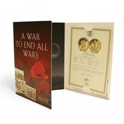 The London Mint Office 'A War To End All Wars', part coin set including Queen Elizabeth II Gibraltar 2017 9 carat gold 10 grams double crown coin etc, in card folder