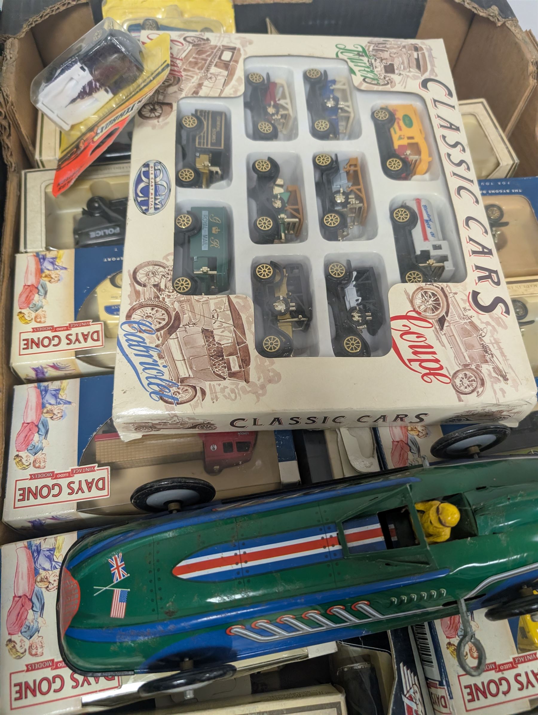 Collection of diecast model vehicles, including Corgi Super Haulers Pickfords lorry, Corgi Bedford Coach, Lledo Days Gone and Trackside models two Maisto motorcycles, etc, all boxed together with a St Johns tinplate Land Speed Record clockwork car