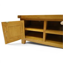 Contemporary oak TV stand, with two open recesses with back apertures for wires, flanked by cupboards 