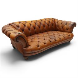 Tetrad - 'Oskar' grande three-seat sofa, Chesterfield shape with rolled arms over serpentine back and front, upholstered in fully buttoned tan leather, raised on reed-moulded feet of globular form
