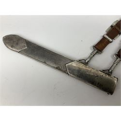 German Reichsarbeitdienst RAD Leader's Hewer dagger, the 26cm single edged scimitar shaped blade with narrow fuller, etched Arbeit adelt; by E.D. Wusthof, Solingen; the aluminium hilt with spade and wheat ear langet; two piece white plastic grip and eagle head pommel; pebbled steel scabbard engraved with ears of wheat and strapwork with double leather hangers L40cm overall