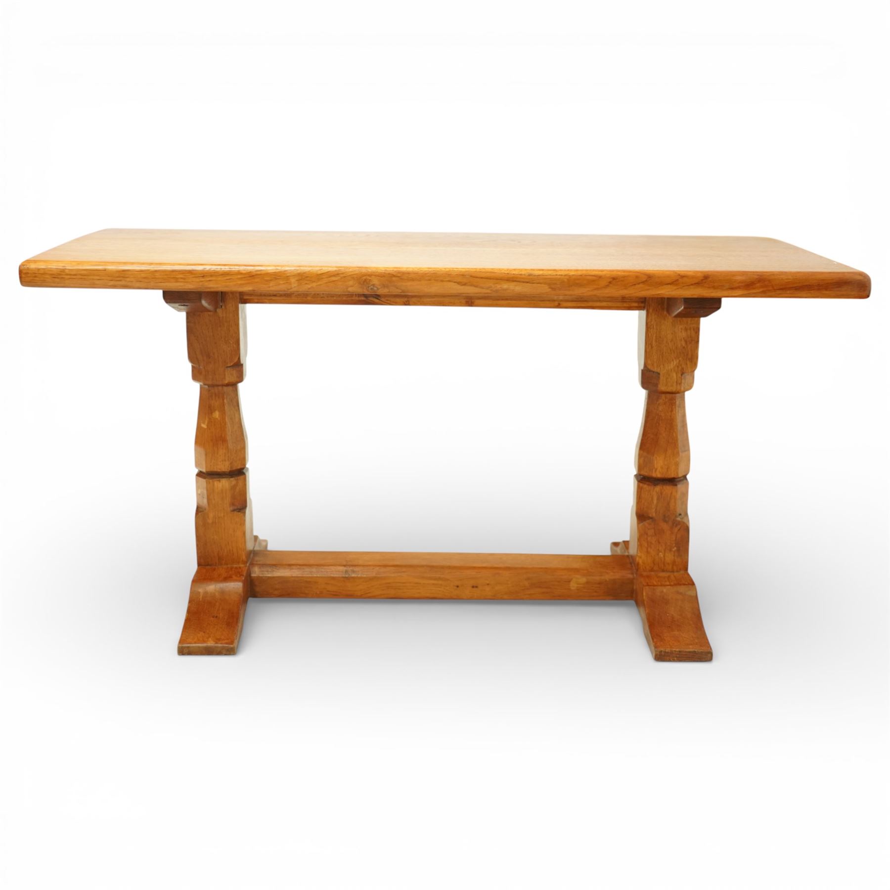 Sid Pollard of Thirsk - Yorkshire oak coffee table, rectangular adzed top with softly moulded edge, raised on twin octagonal baluster supports, united by a plain stretcher, on shaped splayed feet