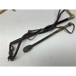Collection of hunting crops and riding whips, including horn handle examples with silver cuffs