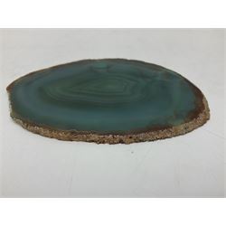 Pair of green agate slices, polished with rough edges raised upon silvered metal stands, H19cm