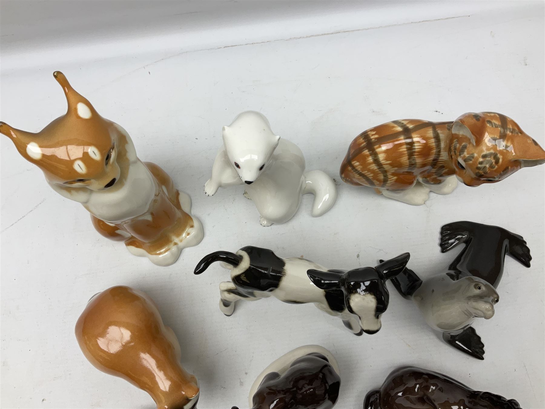 Collection of Russian Lomonosov USSR animal figures, to include  lynx, tiger, red panda, sealion, panada, etc 