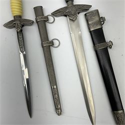 Two reproduction WW2 German daggers - Luftwaffe officer's first pattern; and Luftwaffe officer's second pattern; each with scabbard (2)
