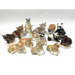 A collection of Russian animal figures, largely comprising Lomonosov examples, to include examples modelled as tigers, zebra, pandas, brown bears, giraffe, and racoons. 