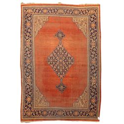 North West Persian Tabriz hand-knotted carpet, salmon field with central elongated lozenge...