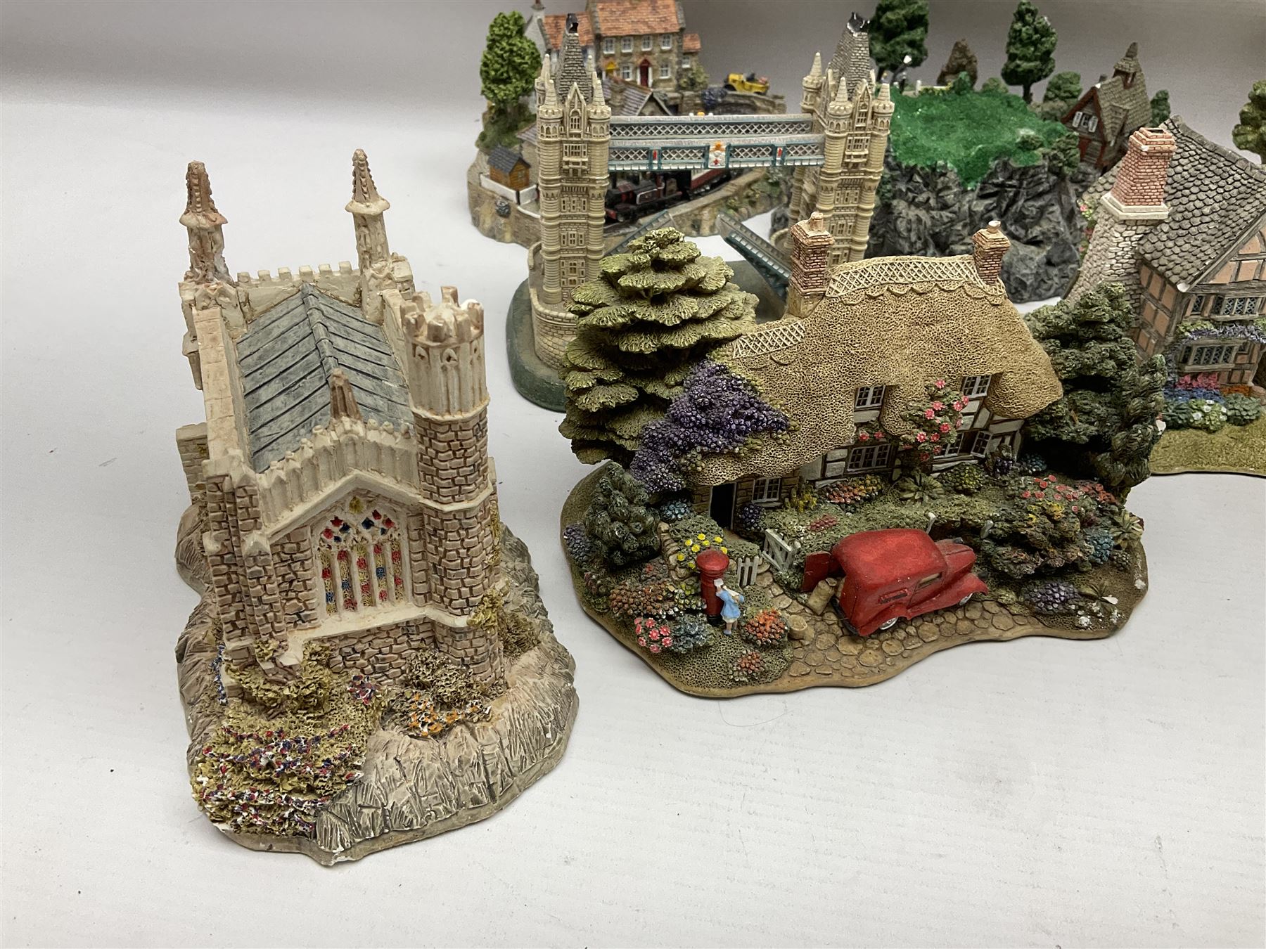Twenty six Lilliput Lane models, to include Golden Harvest, Junk and Disorderley, Heaven Lea Cottage, Old Scrumpy Farm, Chantry Chapel Wakefield, etc, together with four similar cottages