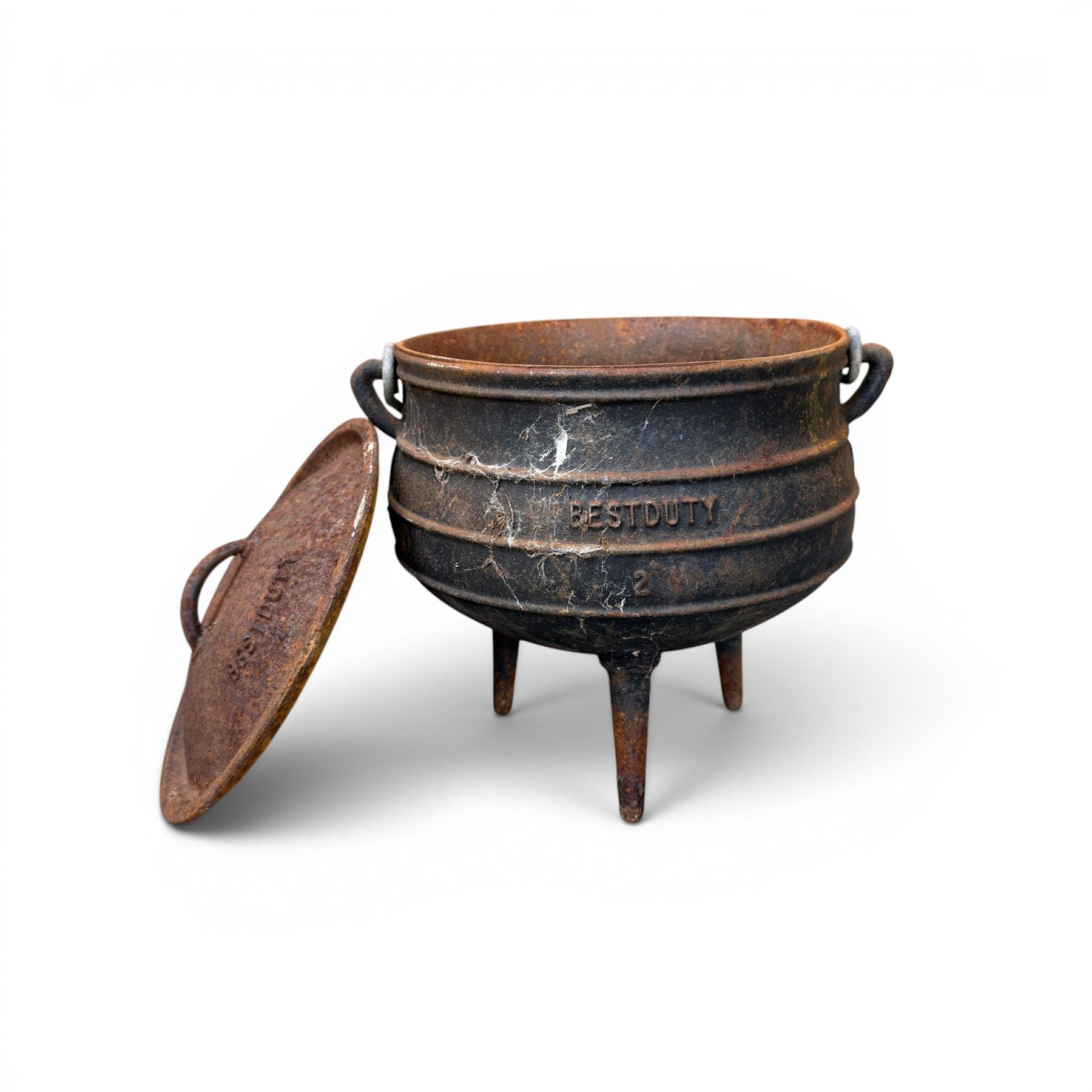 Three South African cast iron graduating cooking pots with lids and handles. Size shown for the largest