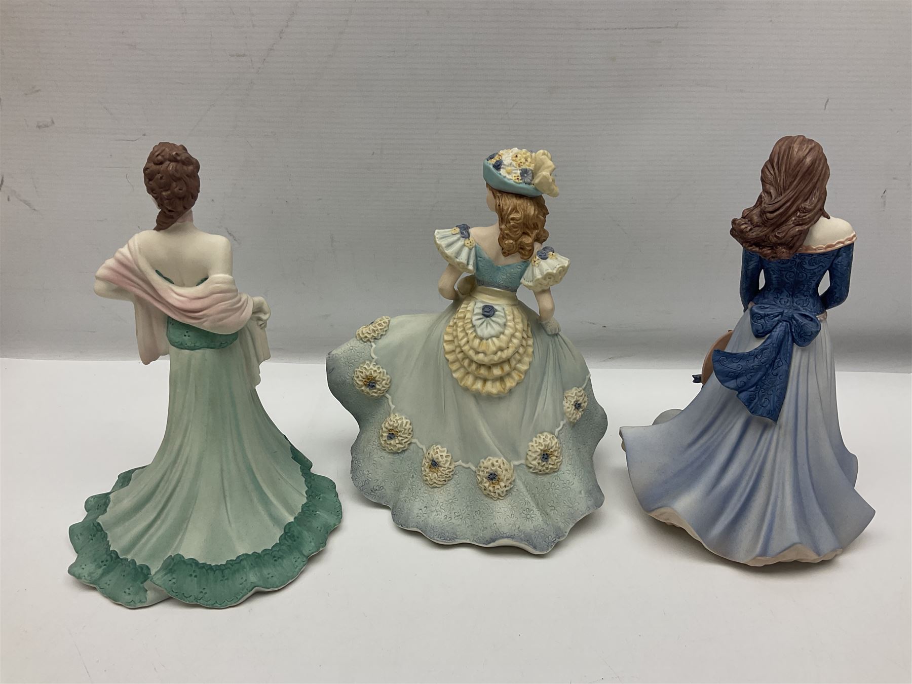 Eight Coalport figures of ladies, comprising five Age of Elegance examples to include Richmond Park, Summer Saunter and Touch of Spring, together with Beau Monde Isobel 1998, Valentine Debutante Eternity and Devotion