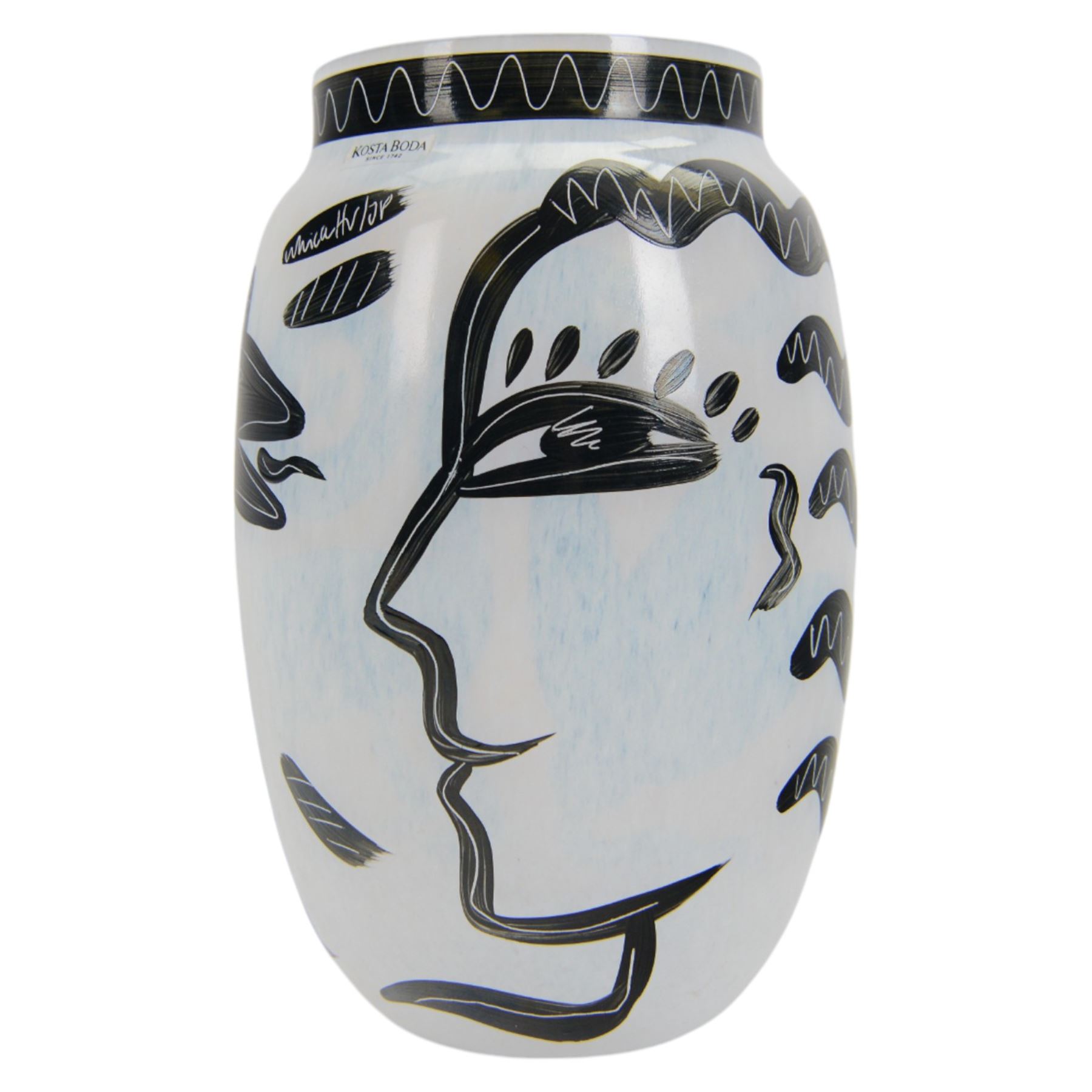 Kosta Boda Open Minds glass footed bowl, the clear glass bowl painted with female facial features, together with a Kosta Boda Caramba vase, of baluster form painted in black with a head in profile and a two headed beast on a white ground, both designed by Ulrica Hydman-Vallien, tallest H19.5cm