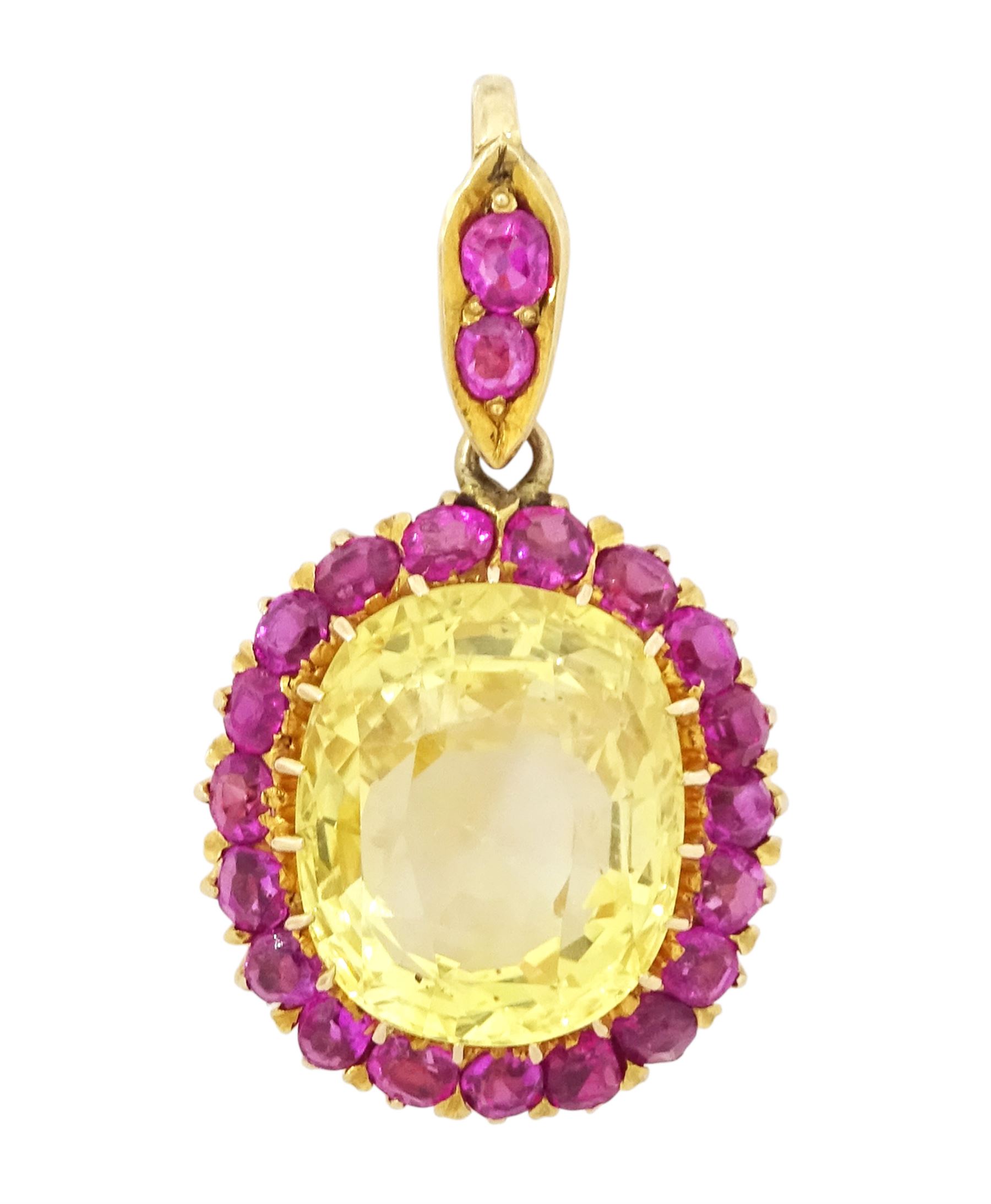 Gold yellow sapphire and ruby pendant, single cushion cut sapphire of approx 10.20 carat, surrounded by nineteen round cut rubies and ruby set bail