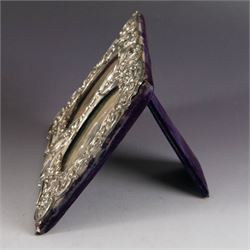 Late Victorian silver double photograph frame, embossed with flowers, scrolls and leaves, hallmarked Cooper Brothers, Sheffield 1899, H13cm, W17cm