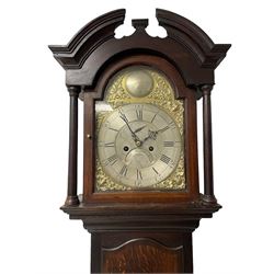 Thomas Hutchinson of Leeds - 18th century 8-day oak longcase clock with as broken arched  pediment and moulded cornice, with a conforming hood door flanked by plain turned pilasters with gesso capitals,  long trunk door with a wavy top on a square plinth with a raised panel, brass dial with cast spandrels,  engraved silvered dial centre and chapter ring with Roman numerals, five minute Arabic's and minute track, with pierced steel hands, seconds pointer,  arched calendar aperture and silvered boss engraved with the makers name to the break arch, dial pinned to a rack striking two train movement with a recoil anchor escapement. With weights and pendulum. Thomas Hutchinson is recorded as working in Leeds from 1760-90.