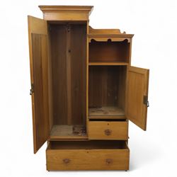Edwardian ash combination wardrobe, moulded cornice over an open compartment and single cupboard door with carved scroll decoration, above two short and one long drawer fitted with brass handles, on shaped bracket supports