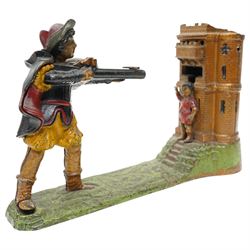 American painted cast iron money bank 'William Tell', the base marked 'Patented June 1896' L26cm and a 'Jolly Nigger' money bank (2)