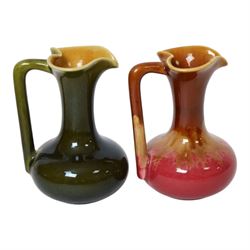 Christopher Dresser for Linthorpe Pottery, two of miniature jugs in red and green, shape number 850, with impressed mark beneath, H9cm