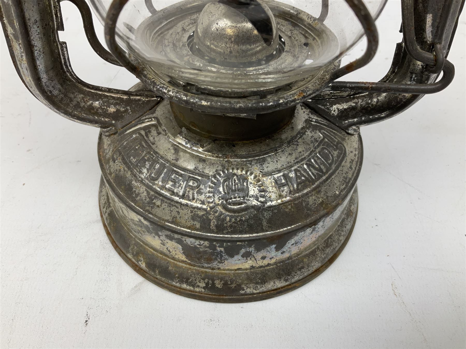 Copper and brass ship’s lamp marked ‘Anchor’, H25cm, Feuer hand storm lantern, Bialaddin Model 315 paraffin lamp and an Anchor lamp (4)