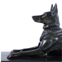 French Art Deco spelter figure of a recumbent dog on marble and onyx plinth, H14cm, L30cm