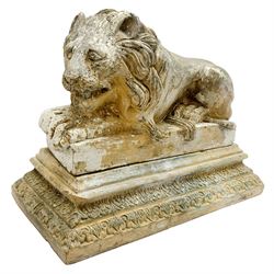 Early 19th century terracotta model of a lion in recumbent pose, upon rectangular stepped base with foliate borders
