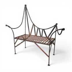 Victorian design wrought iron garden bench, with asymmetrical rope-twist frame, arched back and sides over out-swept arm terminals with ball finials, flanking a lattice seat, in antique black-painted weathered finish