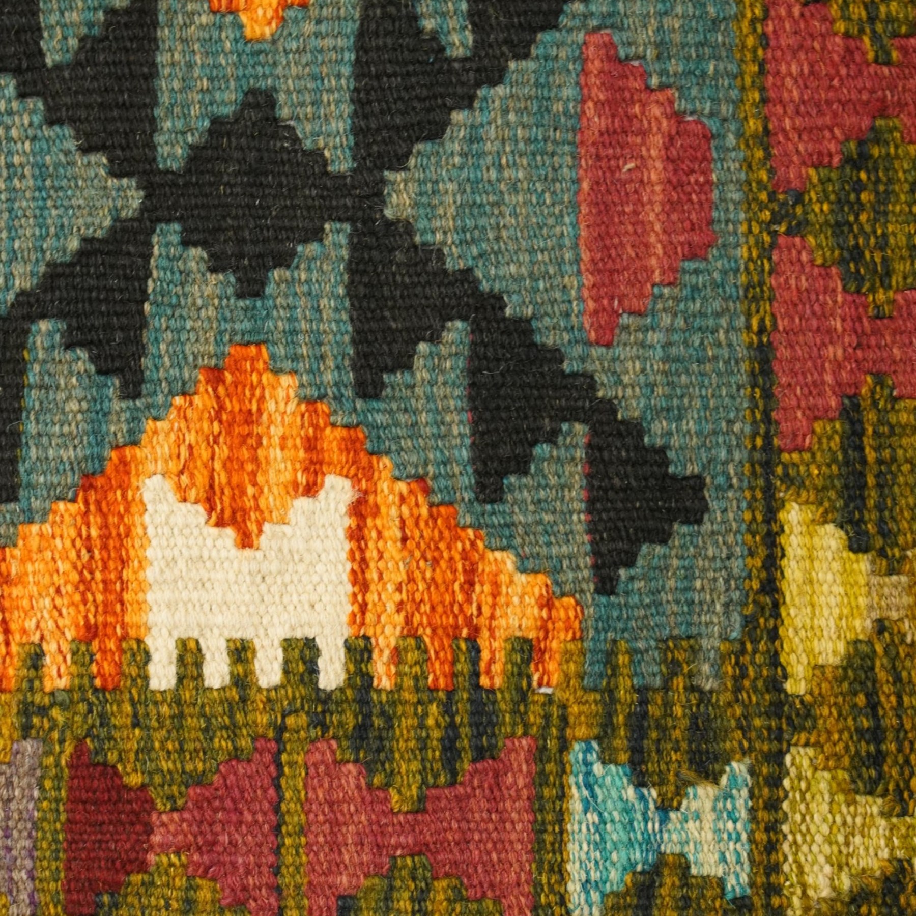 Afghan Chobi kilim flatweave runner rug, the central field decorated with geometric lozenge motifs on a teal ground, the olive guard band with repeating triangular motifs in contrasting colours