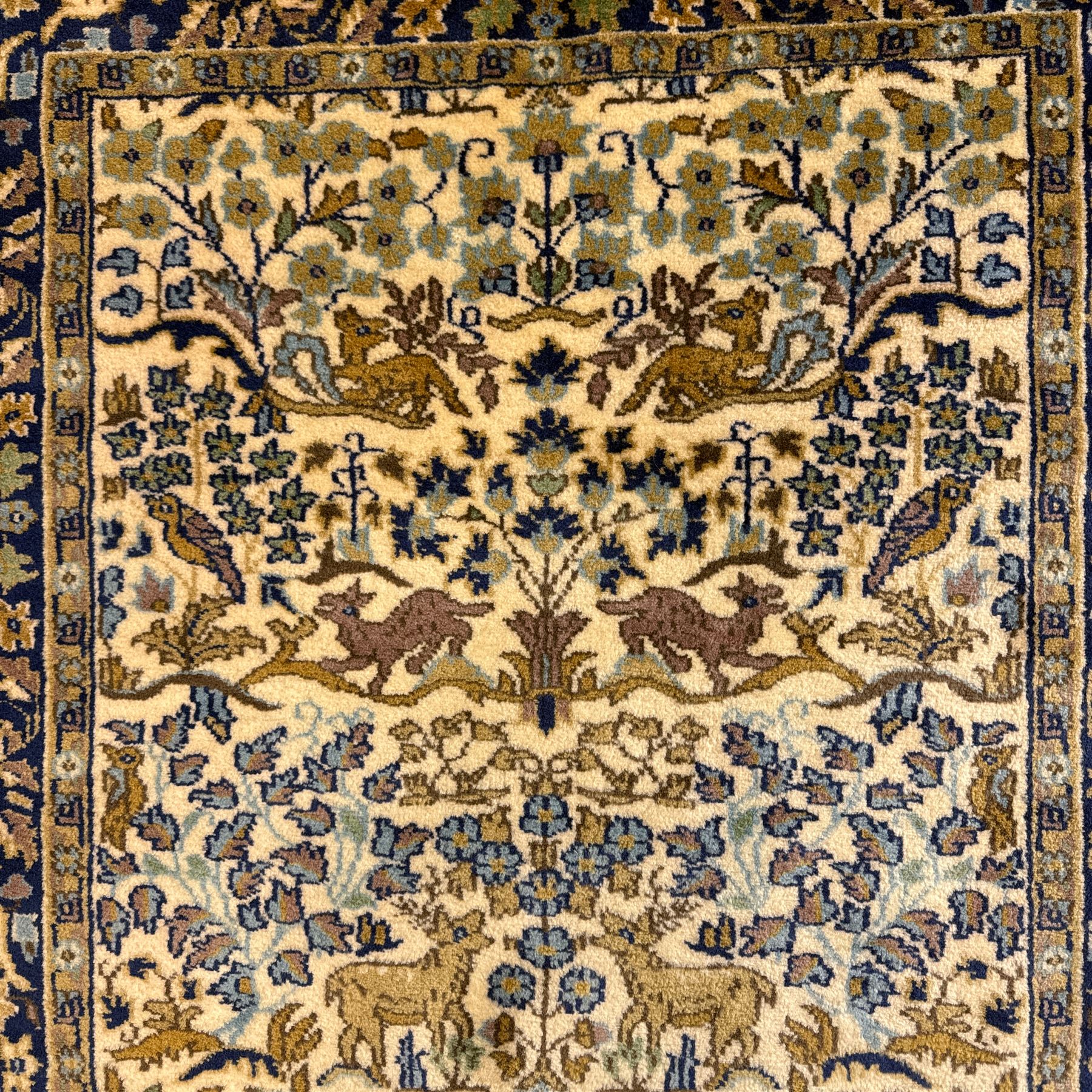 Bokhara rug, earthy ground, with repeating gul motifs, Persian pictorial rug on ivory ground with a densely patterned tree-of-life motif and symmetrically arranged deer, birds, and  other wildlife, 182x149cm & 152x90cm, (2)