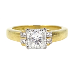 18ct gold princess cut diamond ring, the central diamond of approx 0.80 with two diamonds on either side by Hugh Rice, hallmarked  