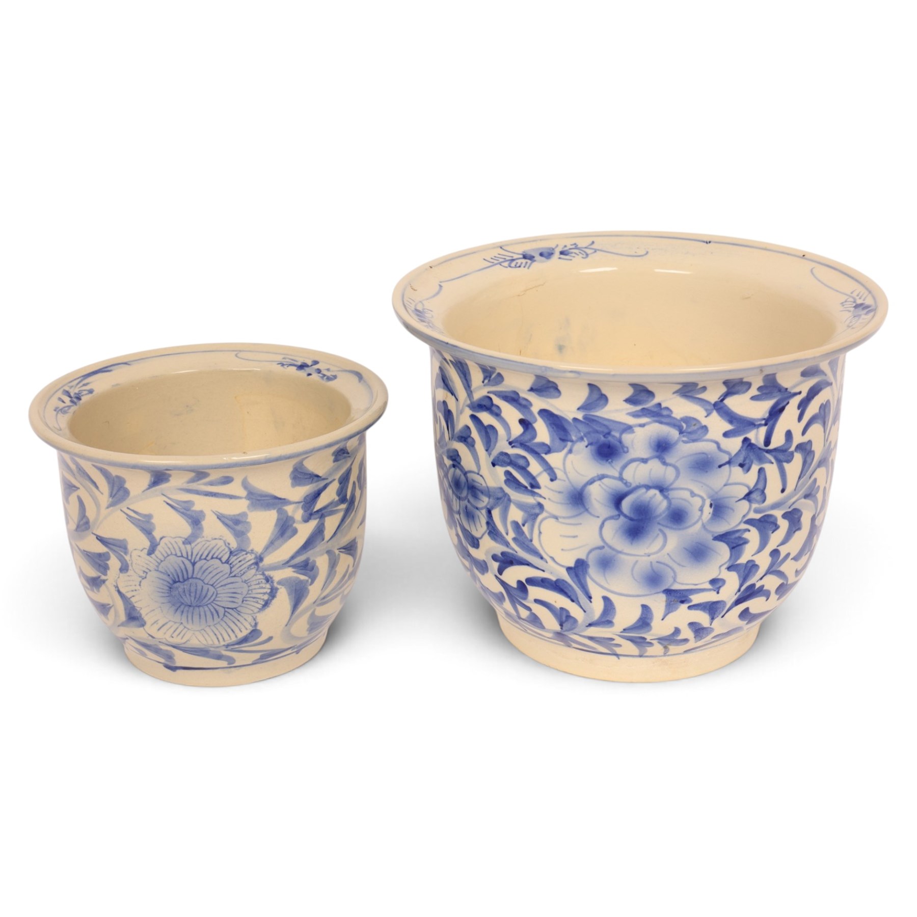 Graduating pair of jardinieres, decorated with peonies amongst foliage, largest H25cm, D32cm 