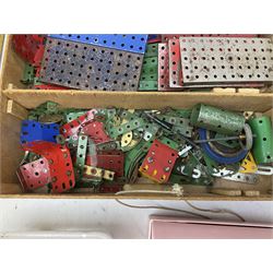 Meccano - quantity of loose playworn sections and pieces, Outfit instruction manuals , housed in yellow painted wood case, along with quantity of playworn die-cast model cars and vehicles etc
