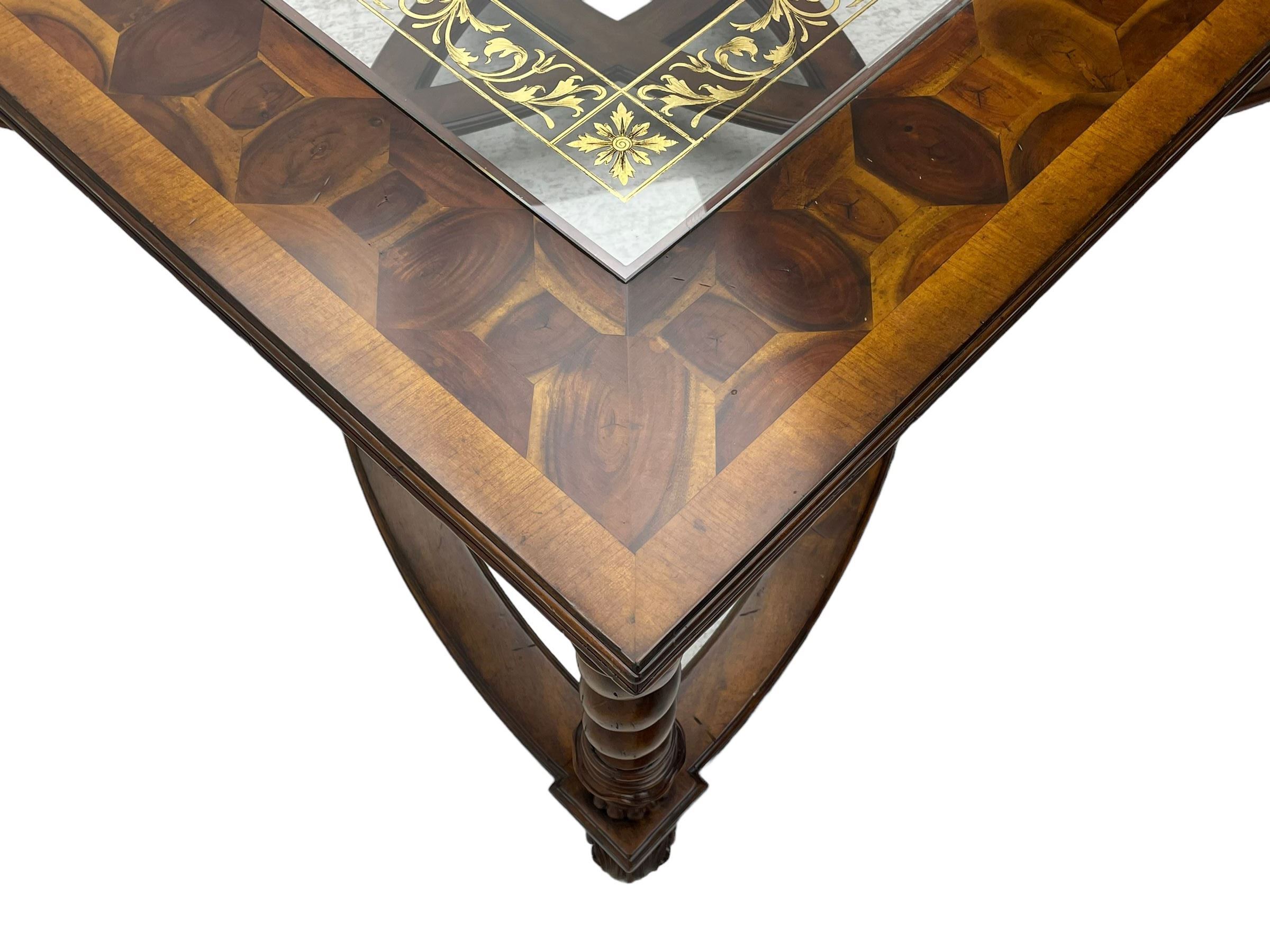 Jonathan Charles - large mahogany coffee table, the square oyster veneered top with verre églomisé inset, the glass hand-painted with gilt scrolling foliate patterns, raised on spiral turned supports with acanthus and gadroon carvings, united by interlocking demi-lune stretchers, on scrolled acanthus feet