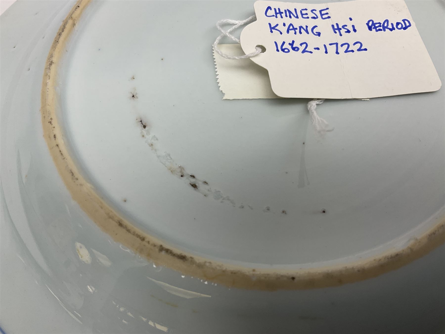 Japanese Meiji period Arita blue and white plate, of circular form, painted with riverside landscape and bird upon flowering branch, with character mark beneath, D24.5cm, together with two 18th century Chinese blue and white plates, each painted with floral design, each approximately D22.5cm