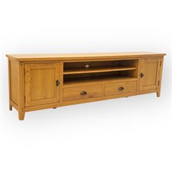 Cotswold & Co - large light oak media stand, rectangular top above central open shelf, dou...