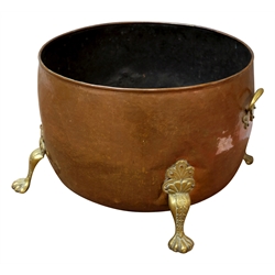  19th century circular beaten copper cauldron log bin with cast brass handles and feet, D54cm x H37cm   