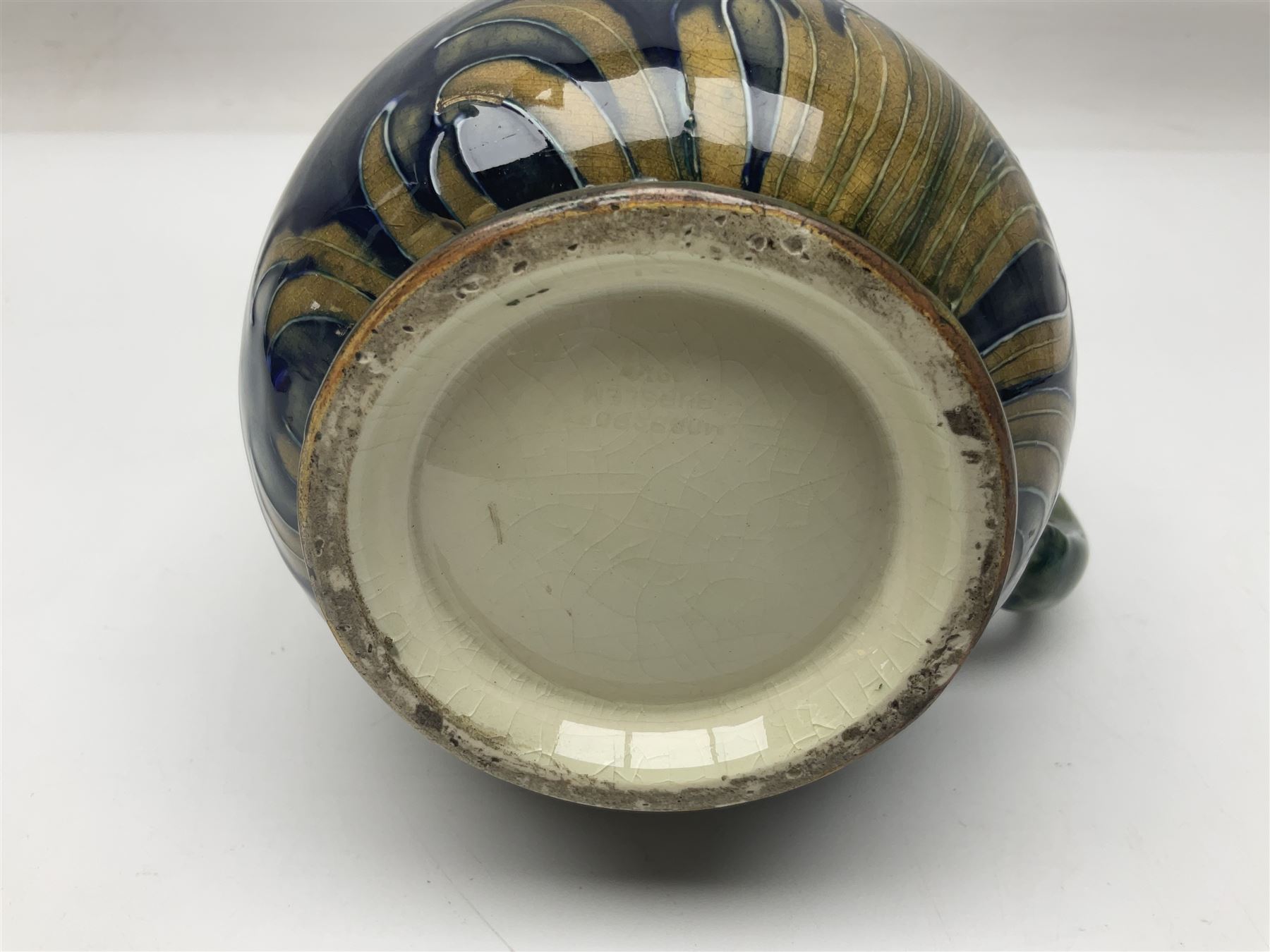 Early 20th century Moorcroft for Macintyre jug, decorated in Revived Cornflower pattern, impressed mark to base, H19cm