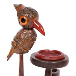 Henry Howell & Co., YZ bird novelty smokers stand, circa 1920-30's, with novelty nut bird with Bakelite beak and tail, with removable Bakelite ashtray on raised wooden plinth, with match holder and striker to the base, stamped YZ TRADE MARK MADE IN ENGLAND to base, 23cm, L21cm  