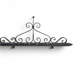 Antique wrought iron sign bracket, with strapwork scroll decoration and arrow form support, in weathered black painted finish